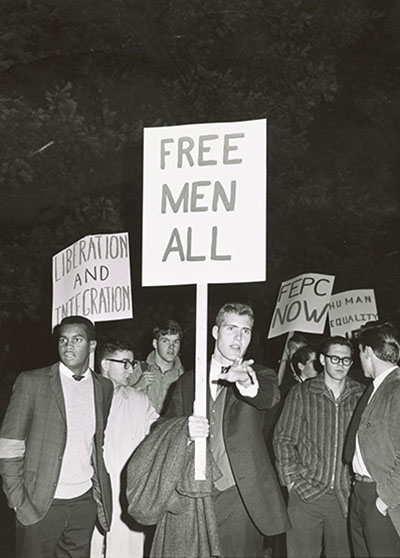 Dartmouth students protesting George Wallace visit. Front sign reads 'free men all'