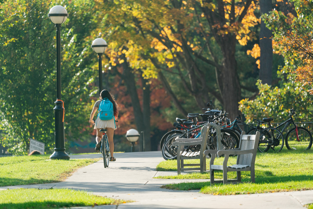 A student bikes on campus.