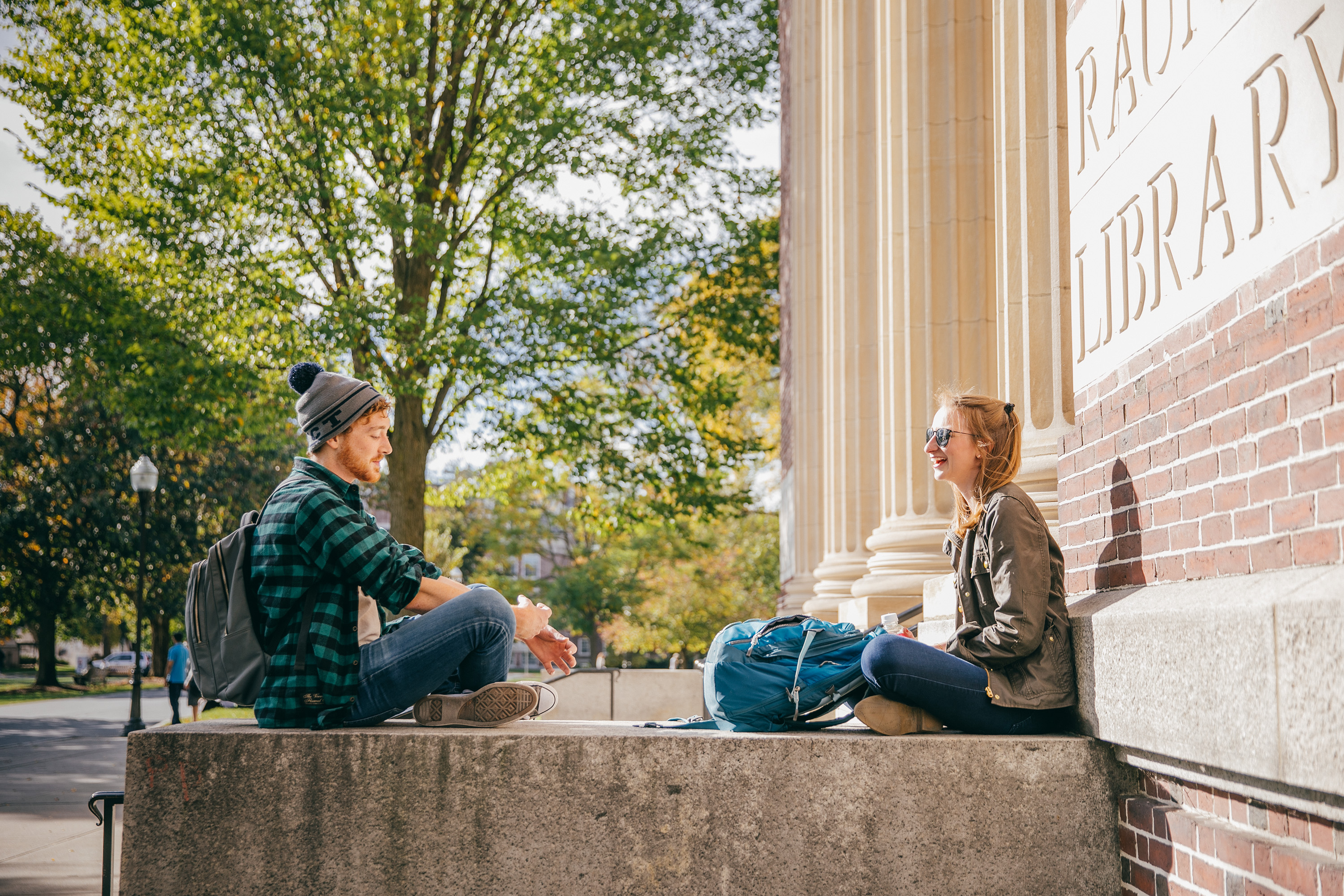 Students sit outside Rauner Hall.